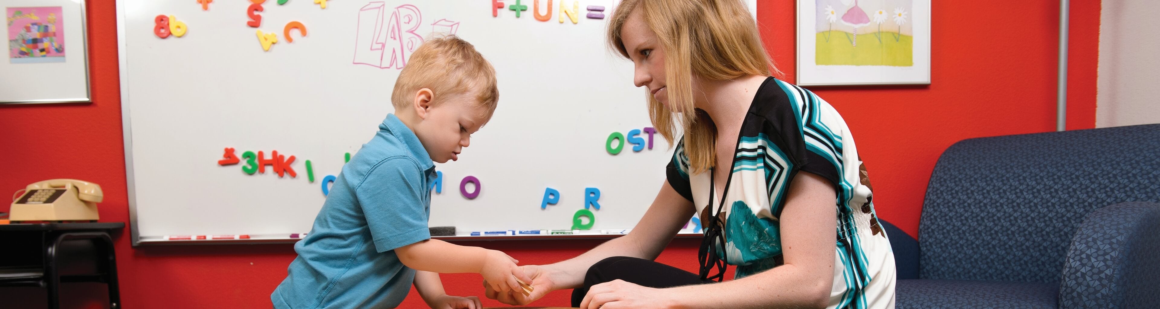 Student working with child