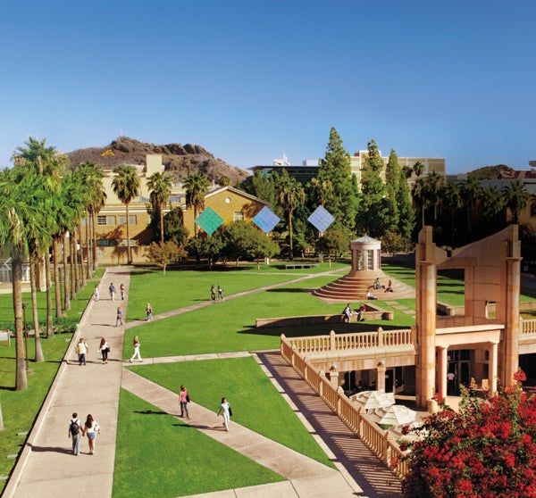 ASU Tempe campus with green lawns, palm trees, pathways, and modern buildings.