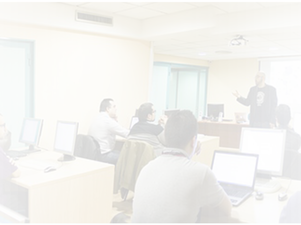 Classroom, students in foreground, instructor in background